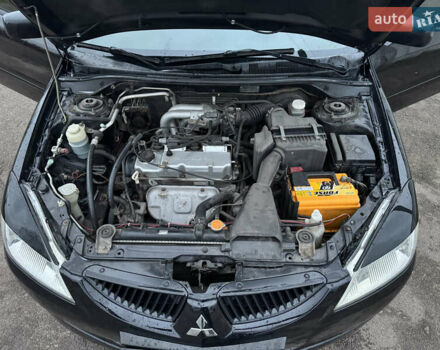 Черный Мицубиси Лансер, объемом двигателя 1.58 л и пробегом 154 тыс. км за 5500 $, фото 21 на Automoto.ua