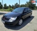 Черный Мицубиси Лансер, объемом двигателя 1.58 л и пробегом 352 тыс. км за 4000 $, фото 1 на Automoto.ua