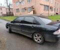 Черный Мицубиси Лансер, объемом двигателя 2 л и пробегом 275 тыс. км за 2599 $, фото 1 на Automoto.ua