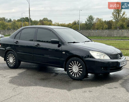 Черный Мицубиси Лансер, объемом двигателя 1.58 л и пробегом 300 тыс. км за 3850 $, фото 7 на Automoto.ua