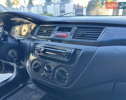 Мицубиси Лансер 2005 в Виннице на Automoto.ua Черный Мицубиси Лансер, объемом двигателя 1.6 л и пробегом 261 тыс. км за 4100 $, фото 53 на Automoto.ua