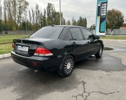 Черный Мицубиси Лансер, объемом двигателя 1.6 л и пробегом 390 тыс. км за 4000 $, фото 4 на Automoto.ua