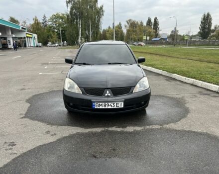 Черный Мицубиси Лансер, объемом двигателя 1.6 л и пробегом 390 тыс. км за 4000 $, фото 1 на Automoto.ua