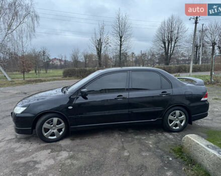 Черный Мицубиси Лансер, объемом двигателя 1.58 л и пробегом 154 тыс. км за 5500 $, фото 6 на Automoto.ua