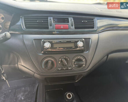 Чорний Міцубісі Lancer, об'ємом двигуна 1.6 л та пробігом 205 тис. км за 3650 $, фото 11 на Automoto.ua