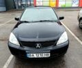 Чорний Міцубісі Lancer, об'ємом двигуна 1.6 л та пробігом 247 тис. км за 4000 $, фото 1 на Automoto.ua