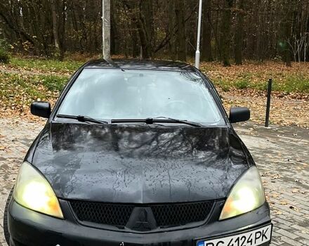 Черный Мицубиси Лансер, объемом двигателя 1.6 л и пробегом 200 тыс. км за 3000 $, фото 1 на Automoto.ua