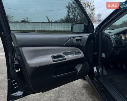 Черный Мицубиси Лансер, объемом двигателя 1.58 л и пробегом 154 тыс. км за 5500 $, фото 25 на Automoto.ua