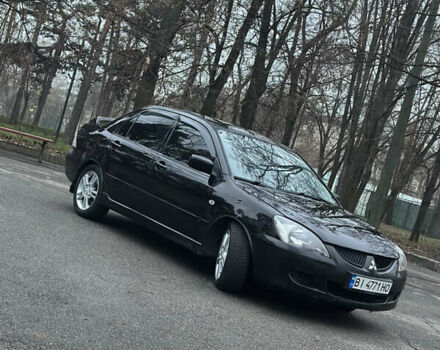Чорний Міцубісі Lancer, об'ємом двигуна 2 л та пробігом 250 тис. км за 3999 $, фото 1 на Automoto.ua