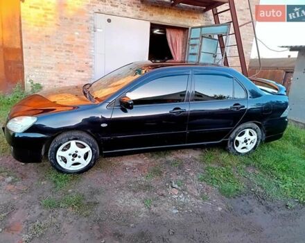Чорний Міцубісі Lancer, об'ємом двигуна 1.58 л та пробігом 294 тис. км за 3800 $, фото 4 на Automoto.ua