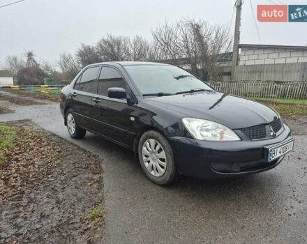 Черный Мицубиси Лансер, объемом двигателя 1.58 л и пробегом 280 тыс. км за 3200 $, фото 5 на Automoto.ua