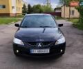 Черный Мицубиси Лансер, объемом двигателя 1.6 л и пробегом 255 тыс. км за 3200 $, фото 1 на Automoto.ua