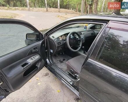 Черный Мицубиси Лансер, объемом двигателя 1.58 л и пробегом 352 тыс. км за 4000 $, фото 2 на Automoto.ua