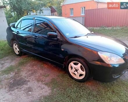 Чорний Міцубісі Lancer, об'ємом двигуна 1.58 л та пробігом 294 тис. км за 3800 $, фото 9 на Automoto.ua