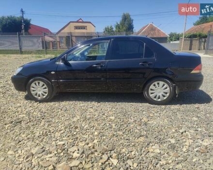 Чорний Міцубісі Lancer, об'ємом двигуна 1.58 л та пробігом 206 тис. км за 3600 $, фото 2 на Automoto.ua