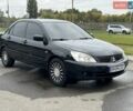 Черный Мицубиси Лансер, объемом двигателя 1.6 л и пробегом 398 тыс. км за 3000 $, фото 1 на Automoto.ua