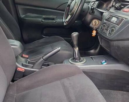 Черный Мицубиси Лансер, объемом двигателя 2 л и пробегом 225 тыс. км за 4400 $, фото 9 на Automoto.ua