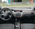 Чорний Міцубісі Lancer, об'ємом двигуна 1.58 л та пробігом 390 тис. км за 4500 $, фото 12 на Automoto.ua