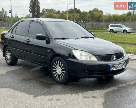 Черный Мицубиси Лансер, объемом двигателя 1.58 л и пробегом 300 тыс. км за 3850 $, фото 1 на Automoto.ua