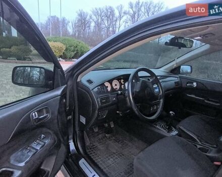 Чорний Міцубісі Lancer, об'ємом двигуна 1.58 л та пробігом 263 тис. км за 4500 $, фото 6 на Automoto.ua