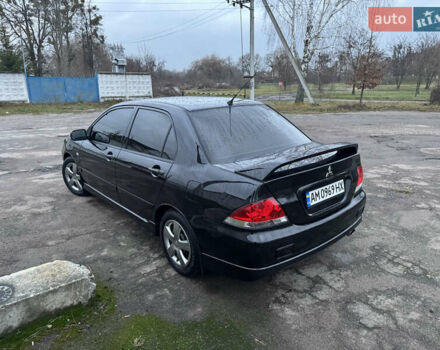 Черный Мицубиси Лансер, объемом двигателя 1.58 л и пробегом 154 тыс. км за 5500 $, фото 12 на Automoto.ua