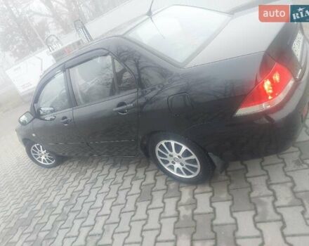 Чорний Міцубісі Lancer, об'ємом двигуна 1.58 л та пробігом 275 тис. км за 3100 $, фото 6 на Automoto.ua