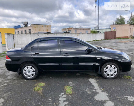 Чорний Міцубісі Lancer, об'ємом двигуна 1.58 л та пробігом 300 тис. км за 3799 $, фото 6 на Automoto.ua