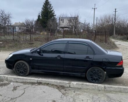 Чорний Міцубісі Lancer, об'ємом двигуна 1.6 л та пробігом 250 тис. км за 3500 $, фото 1 на Automoto.ua