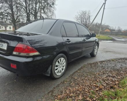 Черный Мицубиси Лансер, объемом двигателя 1.6 л и пробегом 280 тыс. км за 3200 $, фото 4 на Automoto.ua