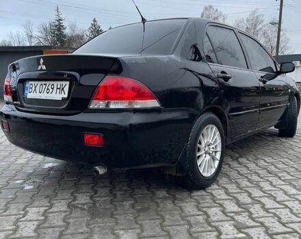 Черный Мицубиси Лансер, объемом двигателя 1.6 л и пробегом 240 тыс. км за 3499 $, фото 1 на Automoto.ua