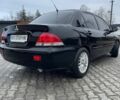 Черный Мицубиси Лансер, объемом двигателя 1.6 л и пробегом 240 тыс. км за 3499 $, фото 1 на Automoto.ua