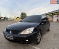 Черный Мицубиси Лансер, объемом двигателя 1.58 л и пробегом 190 тыс. км за 3999 $, фото 1 на Automoto.ua