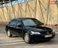 Черный Мицубиси Лансер, объемом двигателя 1.58 л и пробегом 270 тыс. км за 3900 $, фото 1 на Automoto.ua