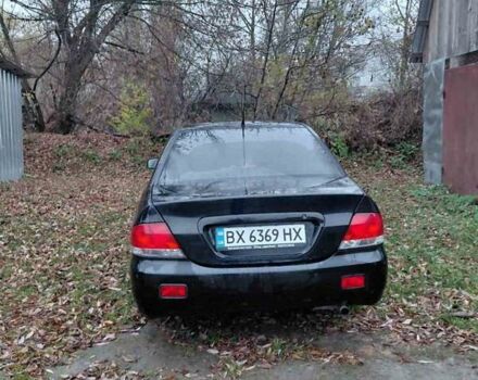 Черный Мицубиси Лансер, объемом двигателя 1.58 л и пробегом 238 тыс. км за 3500 $, фото 8 на Automoto.ua