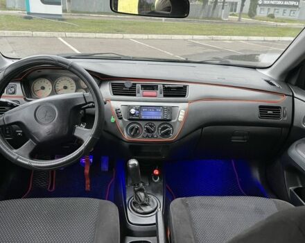 Черный Мицубиси Лансер, объемом двигателя 1.6 л и пробегом 390 тыс. км за 4000 $, фото 7 на Automoto.ua