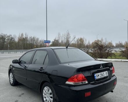 Черный Мицубиси Лансер, объемом двигателя 1.6 л и пробегом 200 тыс. км за 3500 $, фото 2 на Automoto.ua