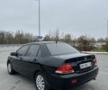 Черный Мицубиси Лансер, объемом двигателя 1.6 л и пробегом 200 тыс. км за 3500 $, фото 2 на Automoto.ua