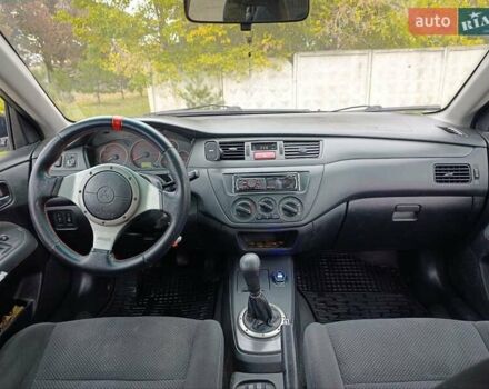 Черный Мицубиси Лансер, объемом двигателя 2 л и пробегом 225 тыс. км за 4400 $, фото 14 на Automoto.ua