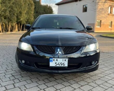 Черный Мицубиси Лансер, объемом двигателя 2 л и пробегом 352 тыс. км за 4100 $, фото 1 на Automoto.ua