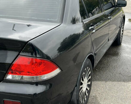 Черный Мицубиси Лансер, объемом двигателя 1.58 л и пробегом 300 тыс. км за 3850 $, фото 10 на Automoto.ua