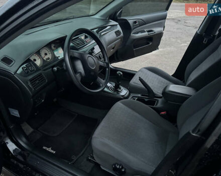 Черный Мицубиси Лансер, объемом двигателя 1.58 л и пробегом 154 тыс. км за 5500 $, фото 26 на Automoto.ua