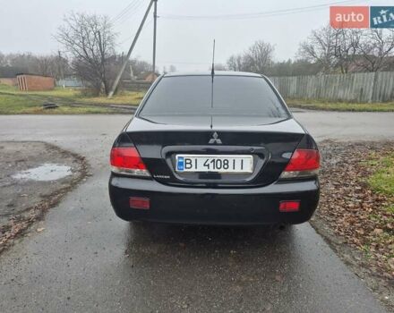 Черный Мицубиси Лансер, объемом двигателя 1.58 л и пробегом 280 тыс. км за 3200 $, фото 3 на Automoto.ua