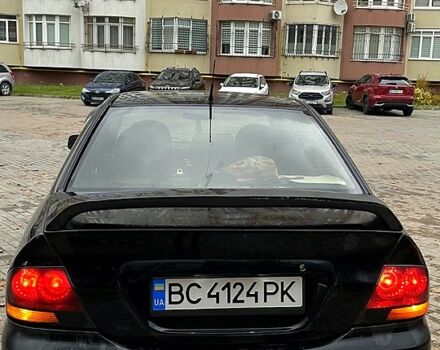 Черный Мицубиси Лансер, объемом двигателя 1.6 л и пробегом 200 тыс. км за 3000 $, фото 4 на Automoto.ua