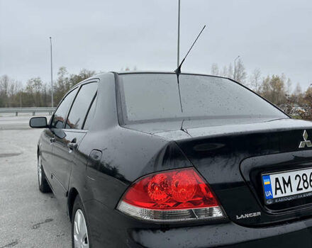 Черный Мицубиси Лансер, объемом двигателя 1.6 л и пробегом 200 тыс. км за 3499 $, фото 4 на Automoto.ua