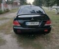 Черный Мицубиси Лансер, объемом двигателя 1.58 л и пробегом 210 тыс. км за 2999 $, фото 5 на Automoto.ua