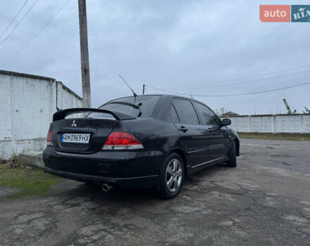 Черный Мицубиси Лансер, объемом двигателя 1.58 л и пробегом 154 тыс. км за 5500 $, фото 8 на Automoto.ua