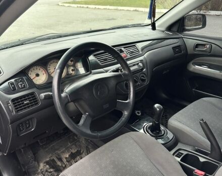 Черный Мицубиси Лансер, объемом двигателя 1.6 л и пробегом 200 тыс. км за 3500 $, фото 12 на Automoto.ua