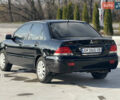 Чорний Міцубісі Lancer, об'ємом двигуна 1.6 л та пробігом 205 тис. км за 3650 $, фото 1 на Automoto.ua