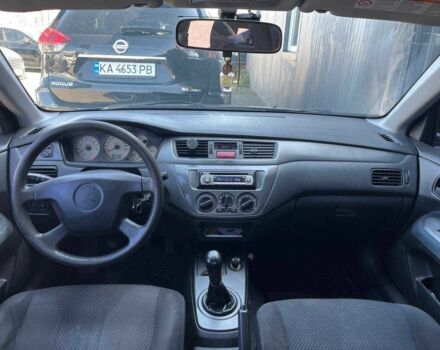 Чорний Міцубісі Lancer, об'ємом двигуна 2 л та пробігом 310 тис. км за 4990 $, фото 12 на Automoto.ua