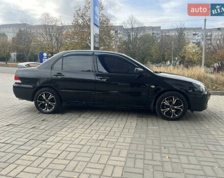 Чорний Міцубісі Lancer, об'ємом двигуна 1.58 л та пробігом 364 тис. км за 4000 $, фото 6 на Automoto.ua